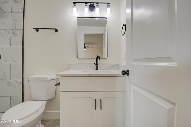 bathroom with toilet and vanity