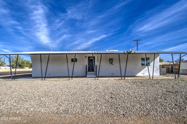 rear view of property featuring central air condition unit