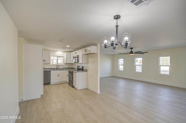 kitchen featuring white cabinets, stainless steel appliances, light hardwood / wood-style flooring, and sink