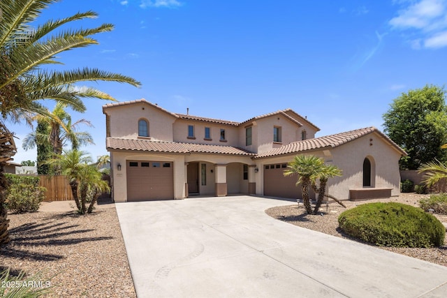 2614 E Carob Dr, Gilbert, AZ 85298 - mediterranean / spanish-style home with stucco siding, concrete driveway, a garage, and a tile roof