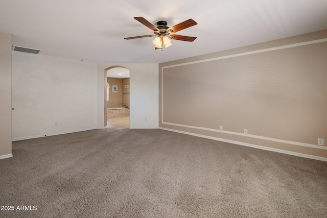 2614 E Carob Dr, Gilbert, AZ 85298 - empty room with arched walkways, ceiling fan, and carpet