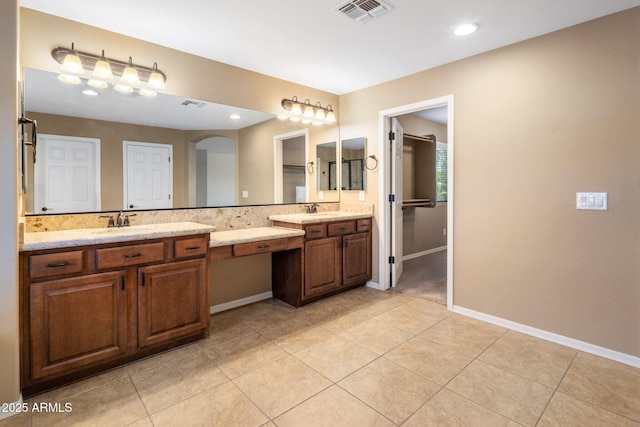 2614 E Carob Dr, Gilbert, AZ 85298 - bathroom featuring double vanity, tile patterned floors, and recessed lighting