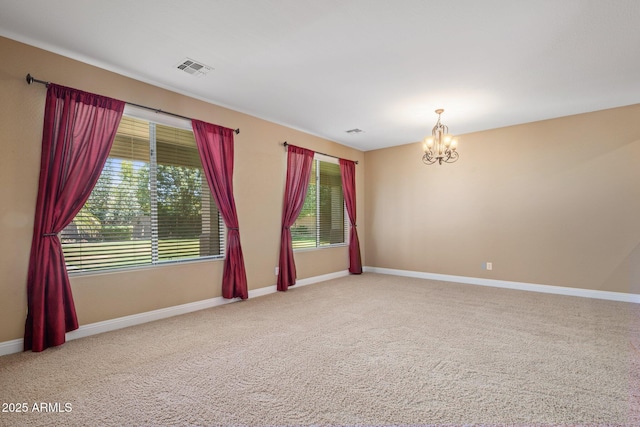 2614 E Carob Dr, Gilbert, AZ 85298 - spare room with a chandelier and carpet flooring