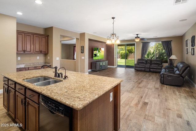 2614 E Carob Dr, Gilbert, AZ 85298 - kitchen featuring black dishwasher, light wood finished floors, open floor plan, pendant lighting, and recessed lighting