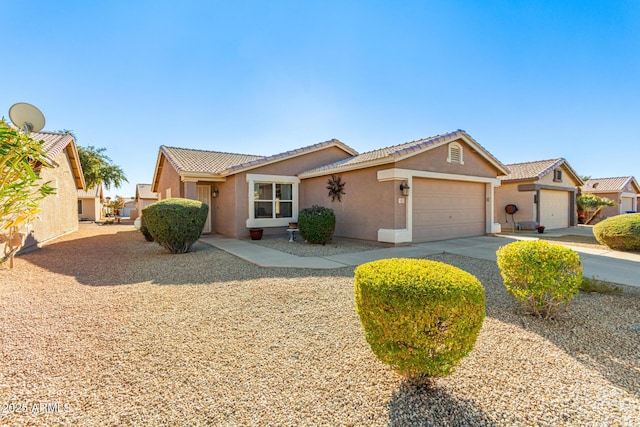 ranch-style home featuring a garage