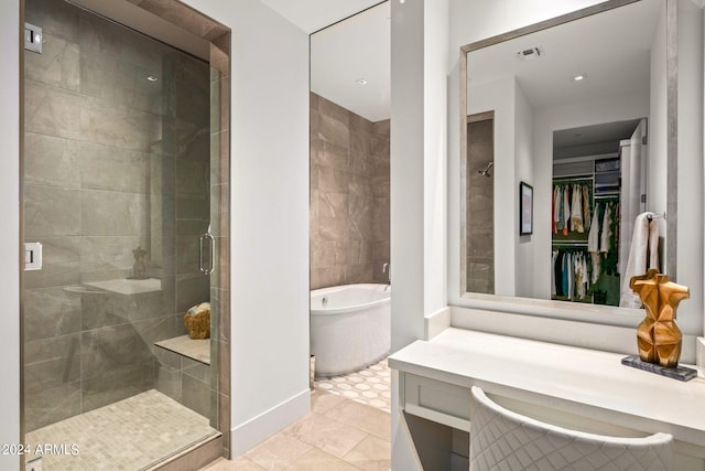 bathroom featuring separate shower and tub, tile floors, and vanity