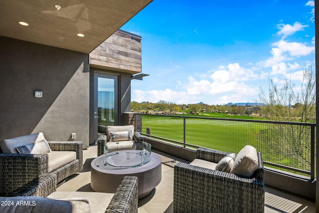 view of terrace with a balcony and outdoor lounge area