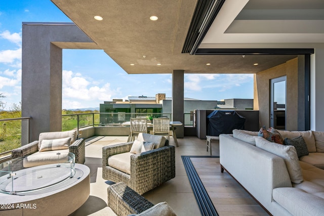 view of patio / terrace with a balcony and an outdoor hangout area