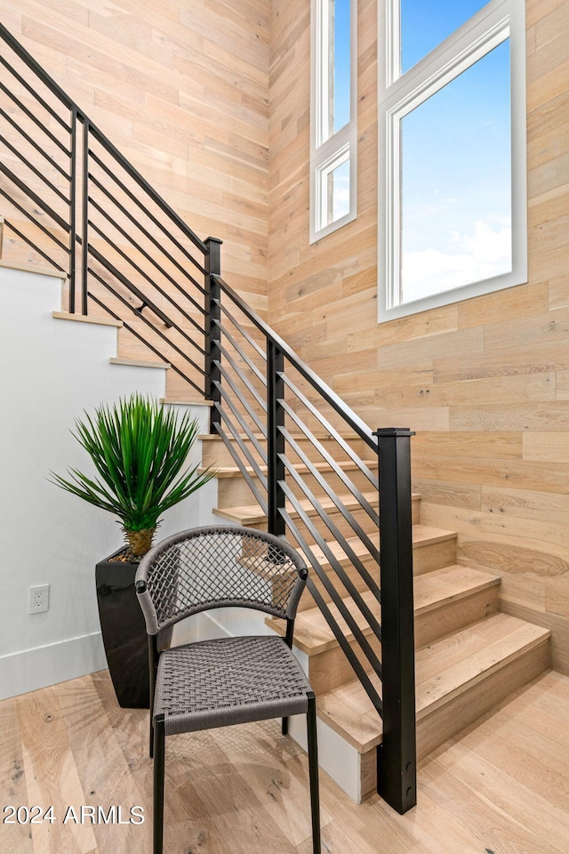 stairway with light wood-type flooring