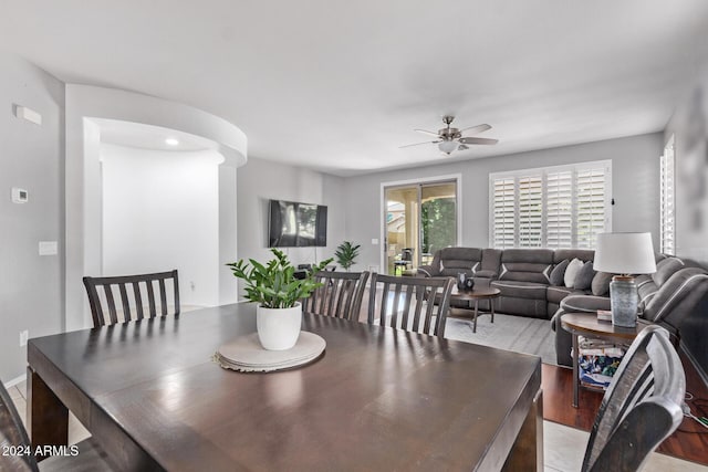 dining space featuring wood finished floors and a ceiling fan