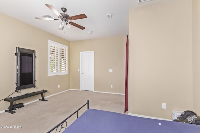 carpeted bedroom with baseboards and ceiling fan