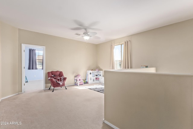 playroom with baseboards, carpet, and a ceiling fan