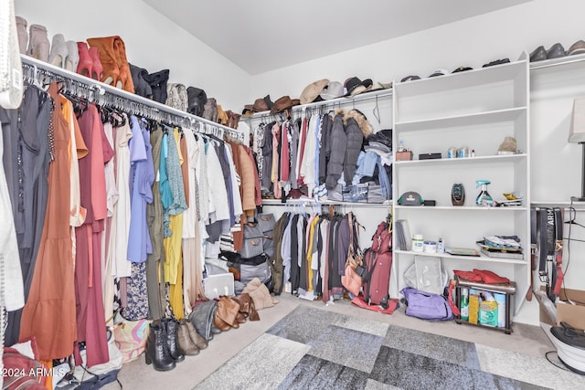 walk in closet featuring carpet