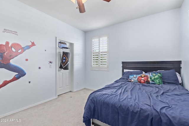 carpeted bedroom with baseboards and ceiling fan