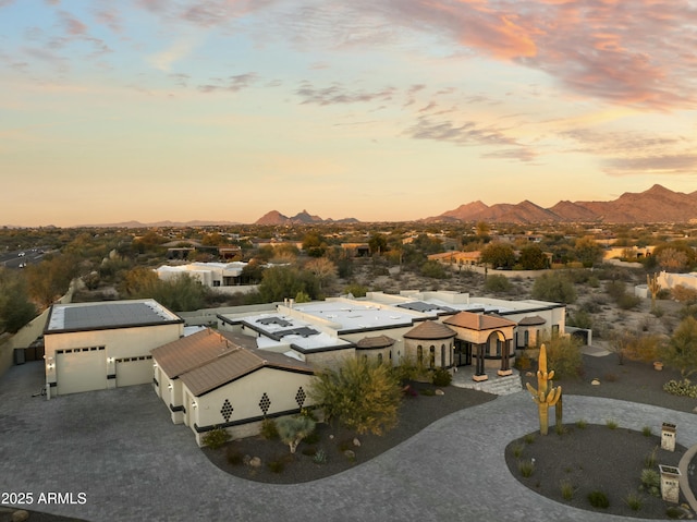 aerial view at dusk with a mountain view