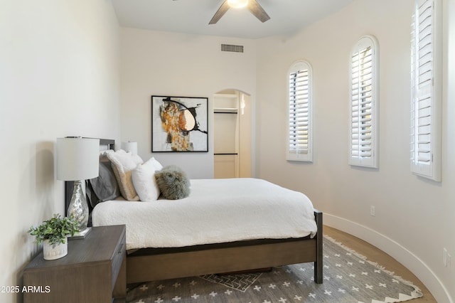 bedroom featuring ceiling fan and hardwood / wood-style flooring