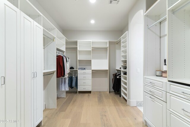 spacious closet featuring light wood-type flooring