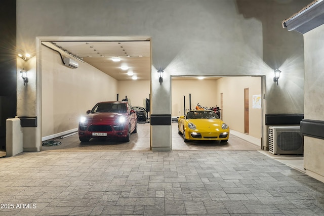 garage featuring an AC wall unit