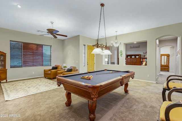 rec room with light carpet, billiards, arched walkways, and baseboards