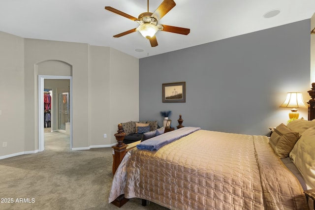 carpeted bedroom with a ceiling fan and baseboards