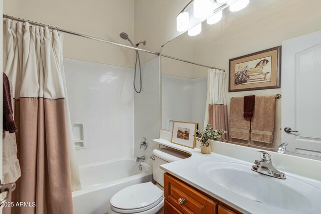 full bathroom featuring toilet, shower / tub combo, and vanity