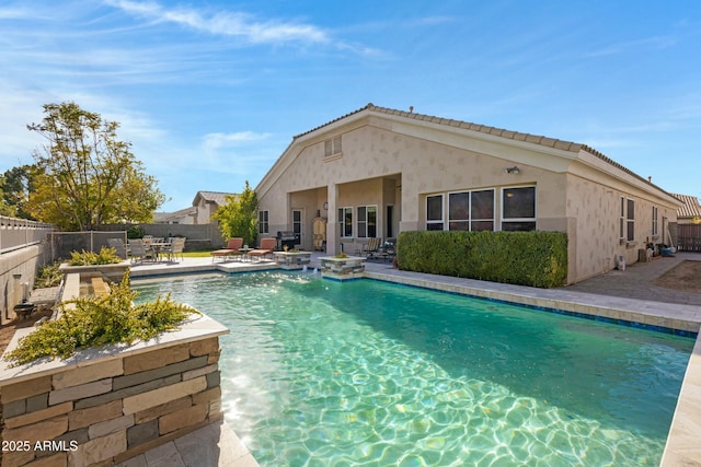 view of swimming pool featuring a patio area, a fenced backyard, and a fenced in pool