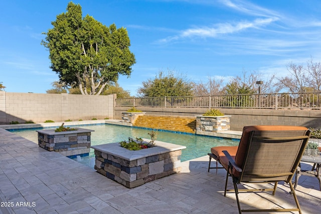 view of swimming pool with a patio, a fenced backyard, and a fenced in pool