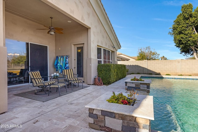 view of patio / terrace featuring a fenced backyard, ceiling fan, and a fenced in pool