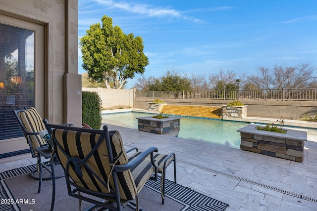 view of patio featuring a fenced in pool and a fenced backyard