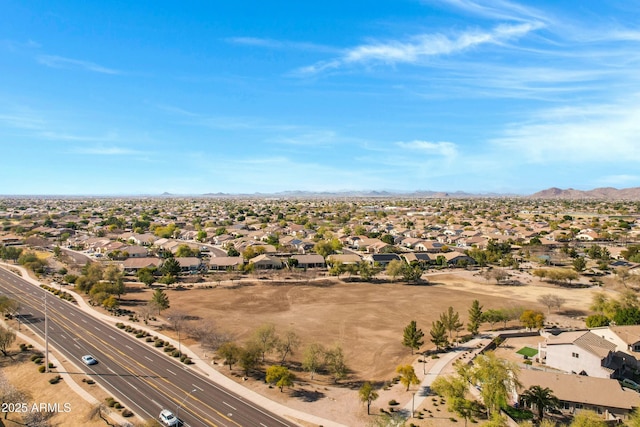 drone / aerial view featuring a residential view and a mountain view