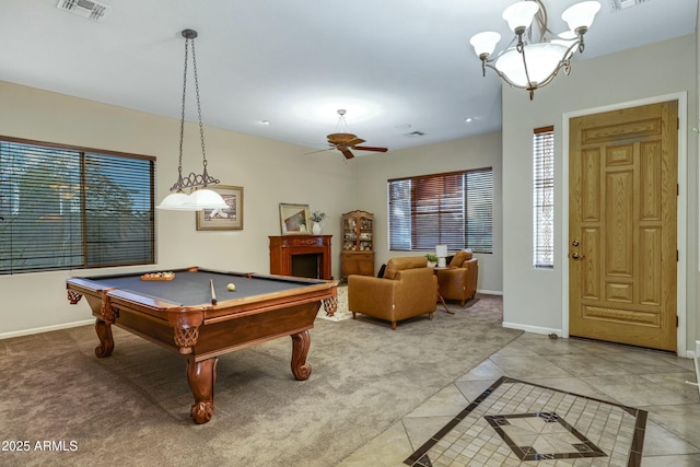 game room featuring light carpet, light tile patterned floors, baseboards, visible vents, and a wealth of natural light