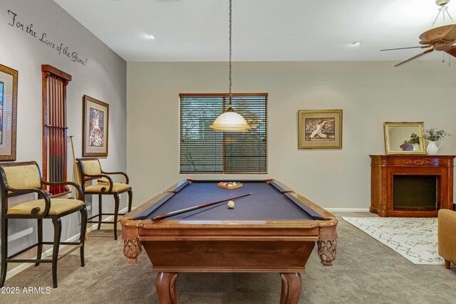 recreation room featuring a fireplace, billiards, a ceiling fan, baseboards, and carpet