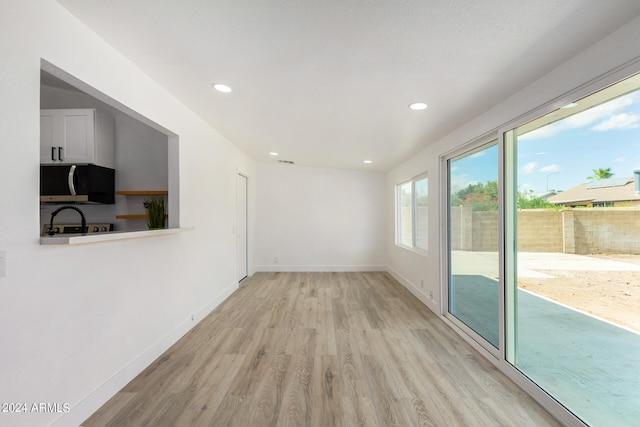 empty room featuring light hardwood / wood-style floors