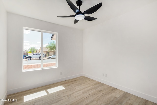 unfurnished room featuring light wood-type flooring and ceiling fan