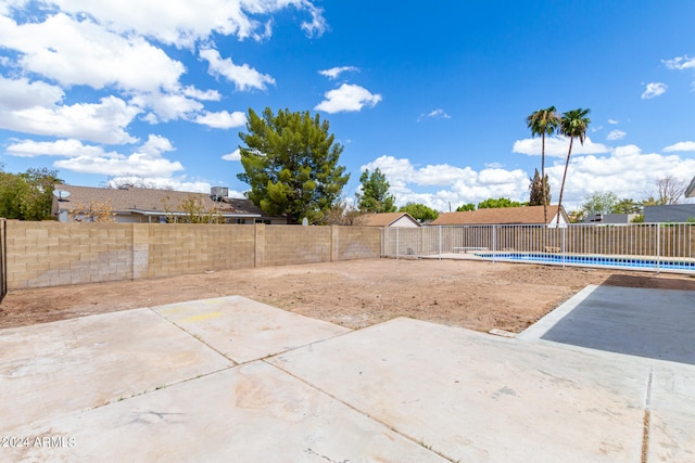 exterior space with an empty pool