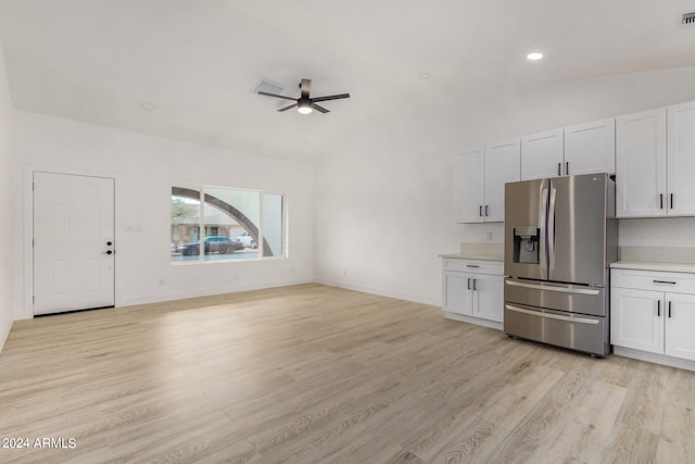 kitchen featuring ceiling fan, white cabinets, lofted ceiling, light hardwood / wood-style flooring, and stainless steel fridge with ice dispenser