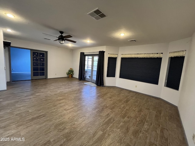 empty room featuring dark hardwood / wood-style flooring and ceiling fan