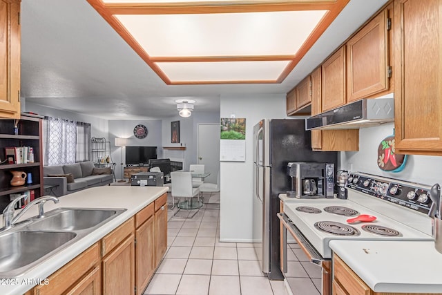 2020 W Union Hills Dr Unit 156, Phoenix, AZ 85027 - kitchen with white electric range oven, under cabinet range hood, light tile patterned floors, and open floor plan