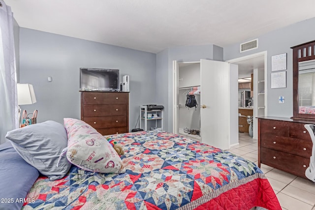2020 W Union Hills Dr Unit 156, Phoenix, AZ 85027 - tiled bedroom with freestanding refrigerator, a walk in closet, and a closet