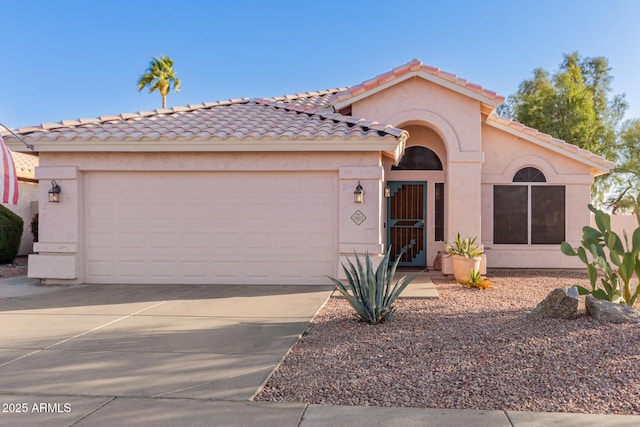 mediterranean / spanish house featuring a garage