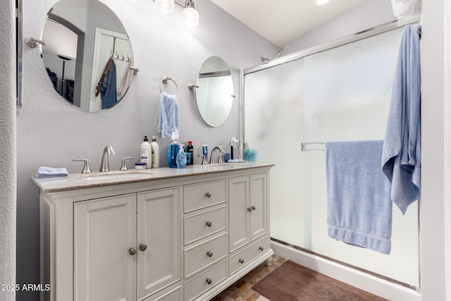 bathroom with vanity and walk in shower