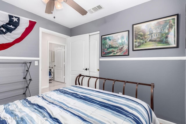 tiled bedroom with ceiling fan