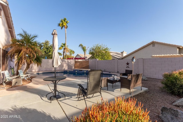 view of swimming pool featuring a patio area