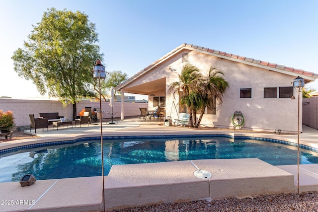 view of swimming pool with a patio area