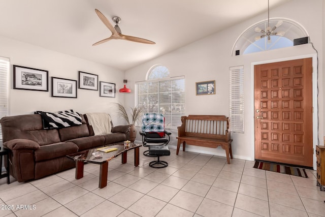 tiled living room with lofted ceiling and ceiling fan