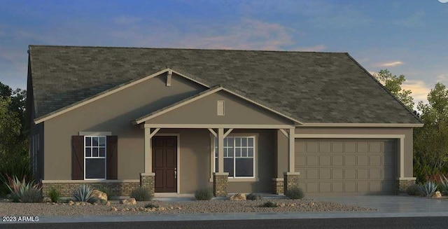 view of front of home with a porch and a garage