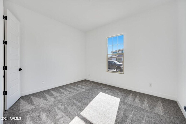 unfurnished room with carpet