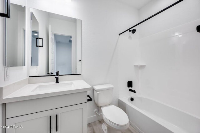 full bathroom featuring bathing tub / shower combination, vanity, wood-type flooring, and toilet