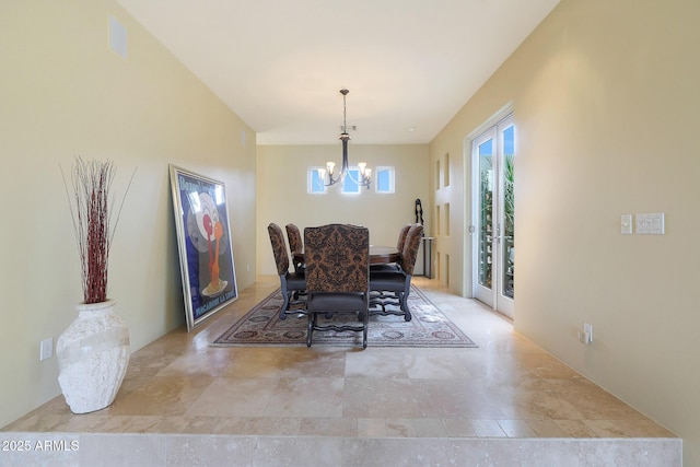 dining space with a chandelier