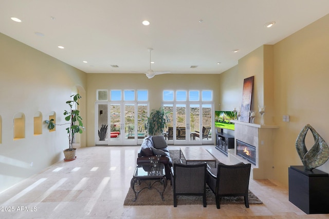 dining room featuring french doors and a tiled fireplace